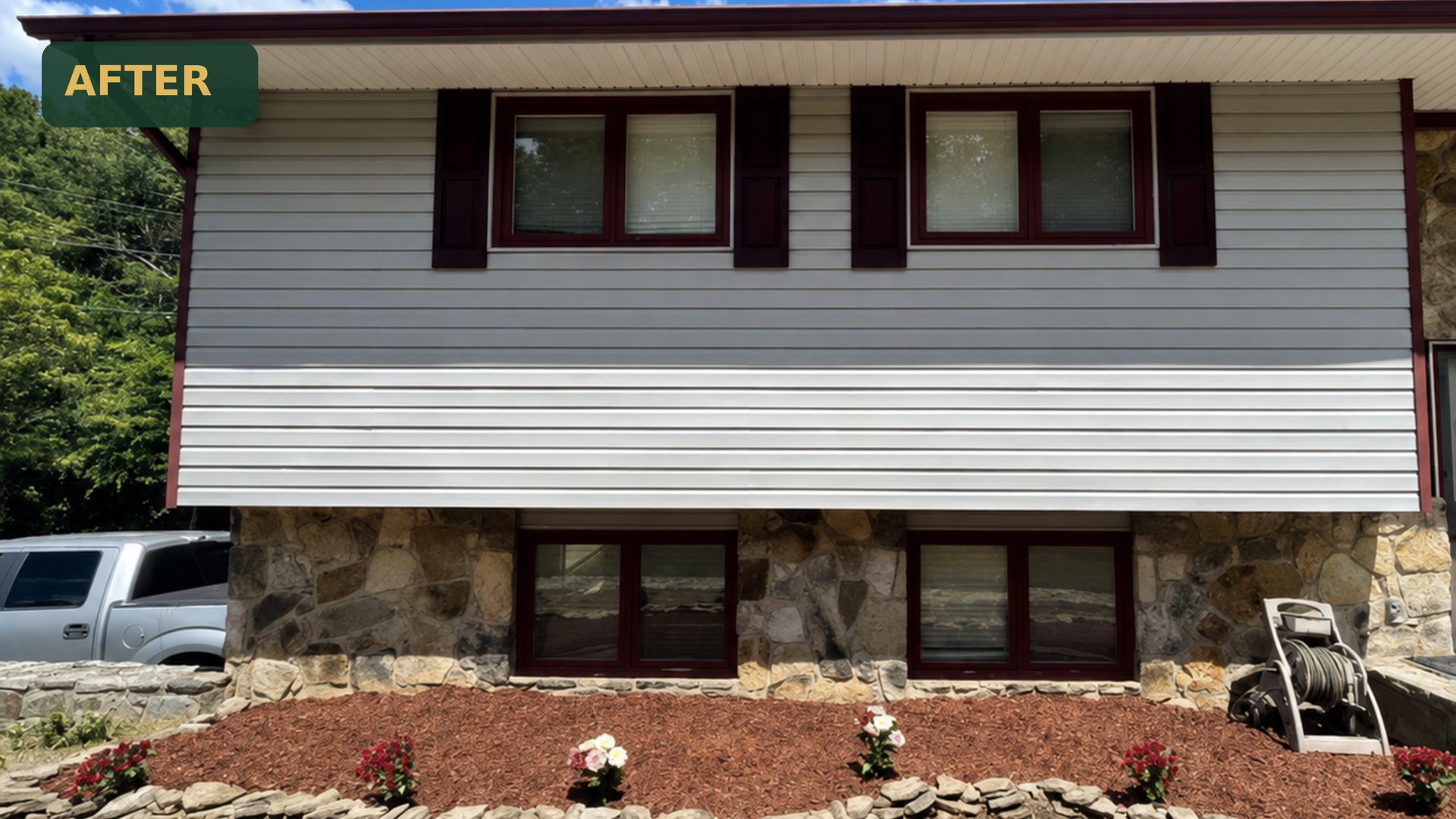 Fresh red mulch, stacked-stone border, and new flowering plants at a split-level home in Chattanooga, TN after LNK Ventures